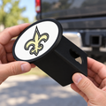 New Orleans Saints Oval Trailer Hitch Cover 2 Inch Receiver Plug Cap NFL - product illustration
